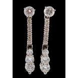 A pair of diamond ear pendants,