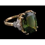 A 14 carat gold green tourmaline and diamond dress ring:,