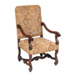 A carved walnut open armchair in the William and Mary taste:,