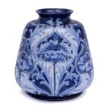 A William Moorcroft for James Macintyre Florian ware vase: of squat baluster form,