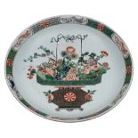 A Chinese famille verte 'basket of flowers' charger: finely enamelled with a large basket of