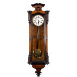 A 'Vienna' regulator wall clock: the eight-day duration weight-driven timepiece movement having a