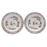 A pair of Chinese verte-imari chargers: each painted with a deer pulling a cart containing a