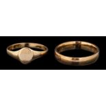 A 9 carat gold ring,: the plain polished band, stamped 375 with import marks,