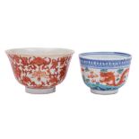 Two Chinese bowls: the first enamelled in iron-red with lotus and bats with Buddhist knots and