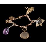 A gold charm bracelet: the faceted belcher links suspending various charms,