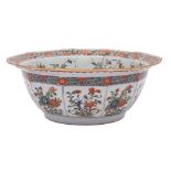 A Chinese famille verte decagonal bowl: finely enamelled overall with flowering shrubs and sprays,