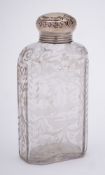 A 19th century Continental clear glass and silver mounted flask: of rectangular outline with canted