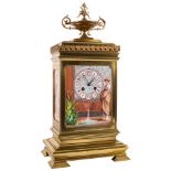 A French gilt-brass and porcelain panelled mantel clock: the eight-day duration movement striking
