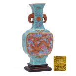 A Chinese famille rose dragon vase: of flattened baluster form with elephant head handles,