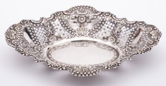 A late Victorian silver basket, maker Jenkins & Timm, Sheffield, 1900: of cartouche-shaped outline,