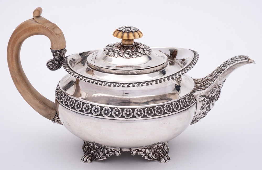 A George IV silver teapot, maker Joseph Craddok and William Reid, London, 1821: crested,