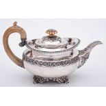 A George IV silver teapot, maker Joseph Craddok and William Reid, London, 1821: crested,