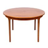 A mid 20th Century circular teak dining table and four chairs by A H McIntosh & Co.