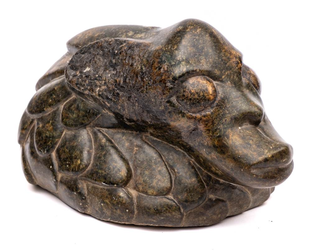 A carved and polished serpentine marble head of a sea creature: in the manner of Frank Dobson,