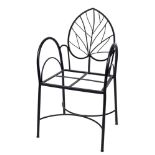 A 20th Century wrought iron open armchair,