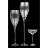 Three monumental wine glasses: comprising two flutes and a champagne bowl, 121, 100 and 46cm high.