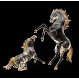 Two Murano glass equestrian figures: modelled in clear glass with some gold inclusions,