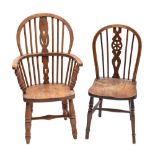 A late 19th century Child's beech and comb back open armchair: on turned stretchered legs,