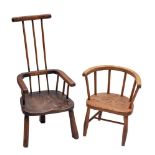 A late 19th century Child's beech and elm stick back open armchair: on three shaped legs,