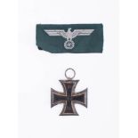 A reproduction WWI Iron Cross, Second Class: together with a later NSDAP cloth badge (2) .