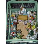 A 20th Century doll's greenhouse flower shop 'Poppies' with figure, flowers and accessories.