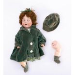 A Simon and Halbig bisque head doll: applied brown wig, blue glass sleeping eyes,