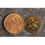 A 1906 Edward VII half sovereign with 9ct gold Princess Charlotte medallion.