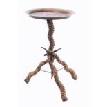 A circular brass occasional table: with antelope tripod supports, 56cm high.