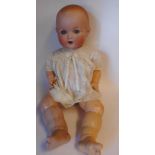 An Armand Marseille bisque head doll: impressed A.M. Germany. 518./9.