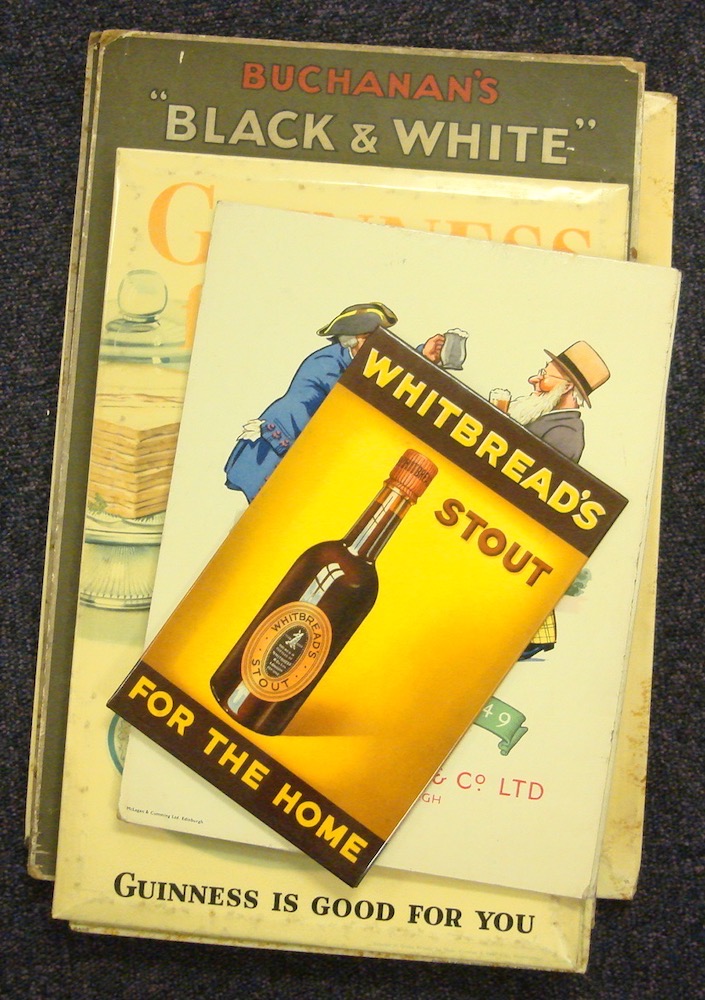 A group of eight mid 20th century pub advertising signs: comprising two Buchanan's 'Black & White',