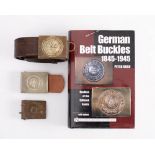 An 1847 pattern German army buckle on a brown leather belt:, the belt stamped 'BAG 10' and '95'.