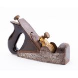 A Norris smoother stamped 'Norris, London': mahogany infill and closed handle,