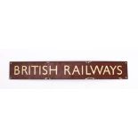 A BR (W) enamel 'British Railways' sign: cream text on a brown ground, 10 x 68.
