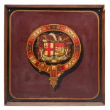 A framed GWR passenger coach armorial: the transfer armorial on a burgundy ground with gold and