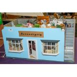 A 20th Century doll's shop 'Serendipity' with fitted interior, figures, fixtures and fittings.