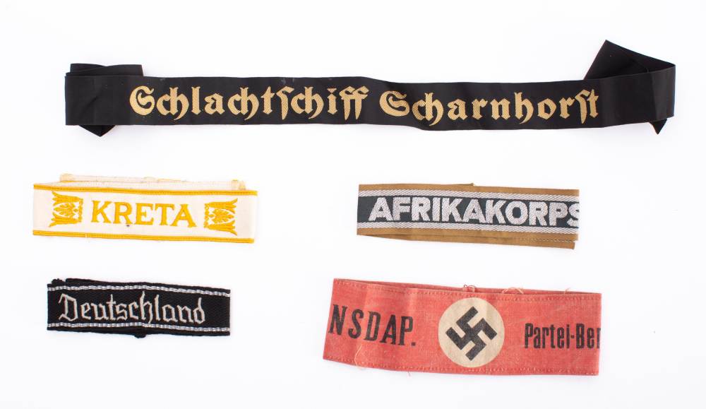 A collection of replica Third Reich period cuff bands: includes Kreta.