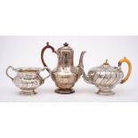 A Victorian silver part tea and coffee set, maker Robert Garrard II, London,