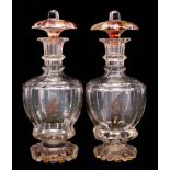 A pair of Bohemian polychrome decorated glass decanters and stoppers: of octagonal form with flared