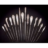 A collection of fifteen assorted silver-handled button hooks,
