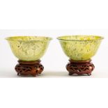 A pair of Chinese jadeite bowls: with rounded sides and everted rims,