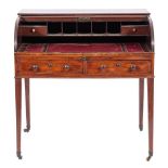 A late George III mahogany roll top desk, circa 1800,: the rectangular top above a tambour front,