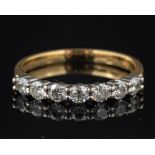 A diamond seven stone ring,: set with brilliant cut diamonds, approximately 0.