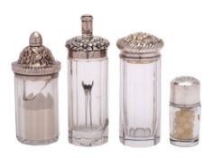 Four American Sterling silver mounted dressing table jars, various makers: one monogrammed,