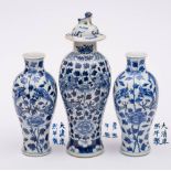 A pair of Chinese blue and white 'dragon' vases and one similar with cover: each painted with