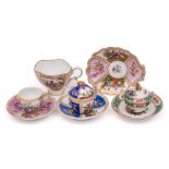 A group of Continental porcelain cups and saucers: comprising a Dresden shell-shaped example,