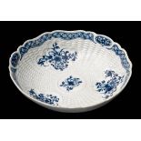 A First Period Worcester blue and white junket dish: with shaped rim,