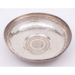 A Persian silver bowl: of beaten circular form,