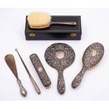 A mixed lot of silver wares, various makers and dates: includes hair brushes, hand mirror,
