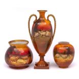 Three Royal Doulton vases: comprising a two handled pedestal vase of slender oviform painted with